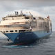 Image for article titled Scorched Cargo Ship Carrying Thousands Of Vehicles Towed, Damage Will Now Be Assessed